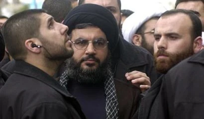 نصرالله محاطاً بمرافقيه في الضاحية الجنوبية نصرالله محاطاً بمرافقيه في الضاحية الجنوبية