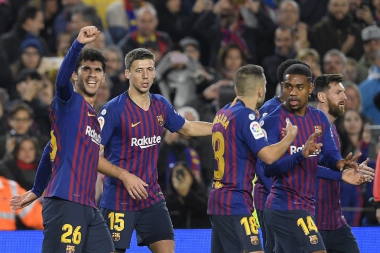 فاز برشلونة واستفاد من تعادل إشبيلية (أ ف ب) فاز برشلونة واستفاد من تعادل إشبيلية (أ ف ب)